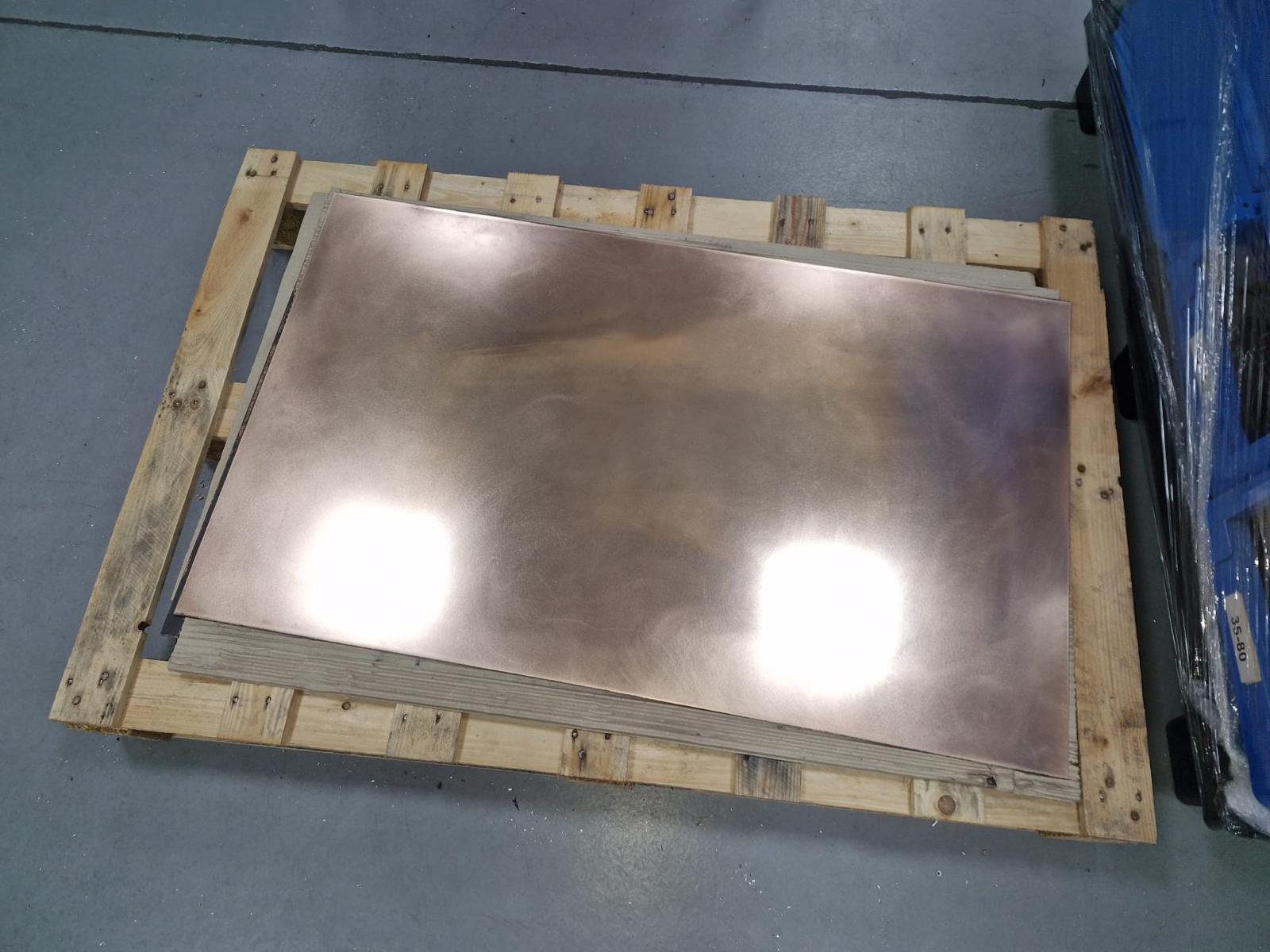 Raw bronze plates on wooden pallets